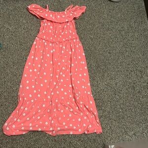 It’s a bright colored floral dress it has white flowers and it’s long